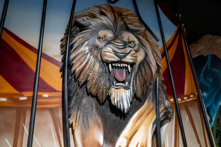 Fearsome lions and colorful clowns greet you in a circus-themed street art spectacle at Drive Shack's mini golf by Puttery.